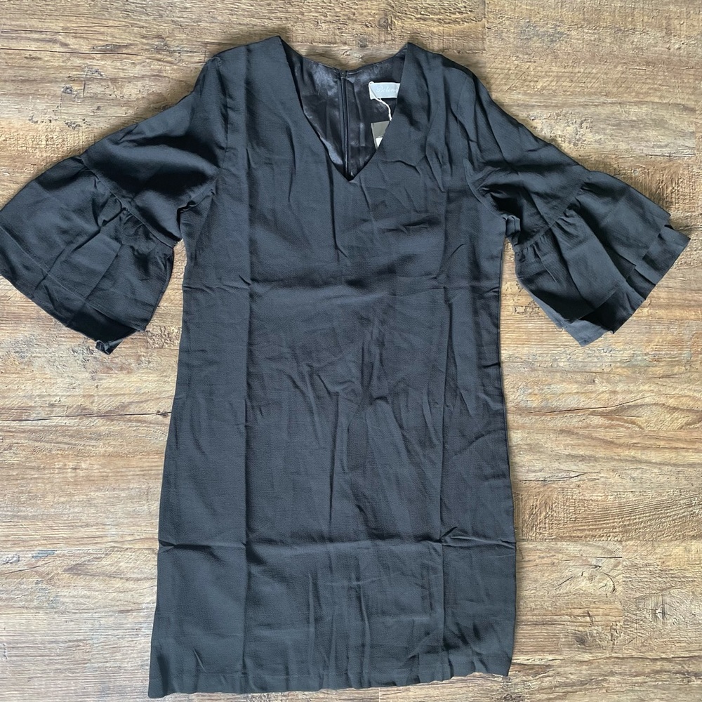 Never worn with tags. Formal black dress with ruffled sleeves. Size: XS
